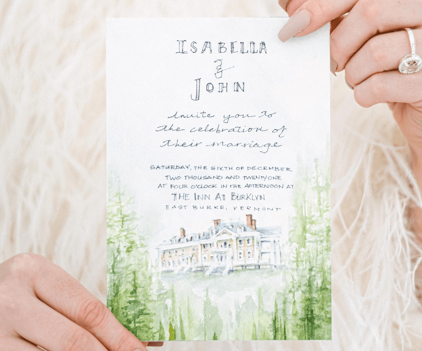 An invitation card for Isabella and John's wedding, featuring a watercolor illustration of a venue.