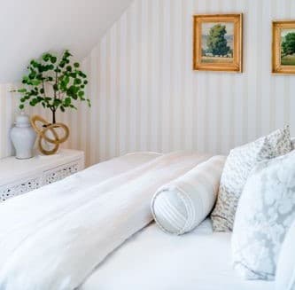 Located on the 3rd floor with a view of the formal gardens, this room has a king-sized bed, writing desk, marble tiled bathroom with a walk-in shower. 245 sq. ft.