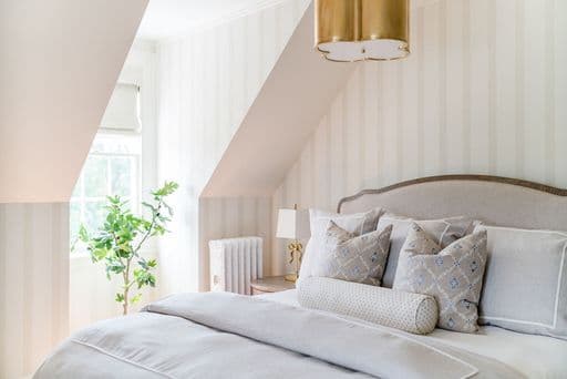A corner view room on the 3rd floor with a king-sized bed, writing desk, marble tiled bathroom with a walk-in shower. 300 sq. ft.