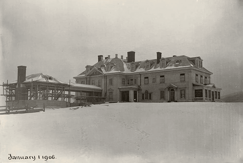 Historic snowy mansion under construction, dated January 1, 1906.